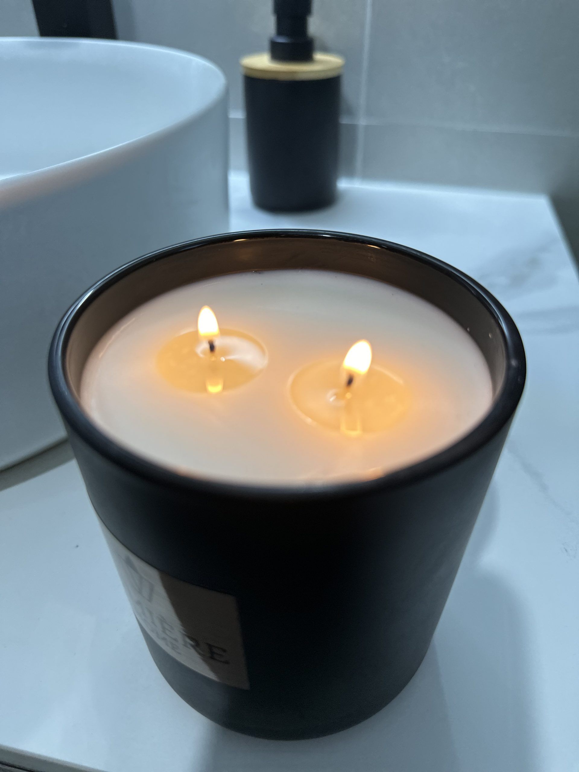 black Lumiere lit candle with tunnelling